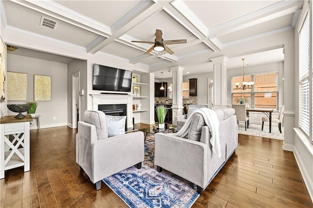 2396 Whiteoak Bnd SE Unit 16, Smyrna, GA 30080 - living area featuring decorative columns, a fireplace, dark wood-type flooring, a chandelier, and baseboards