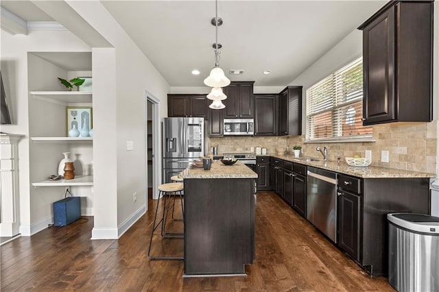 2396 Whiteoak Bnd SE Unit 16, Smyrna, GA 30080 - kitchen featuring stainless steel appliances, dark wood finished floors, light stone counters, a kitchen breakfast bar, and a kitchen island