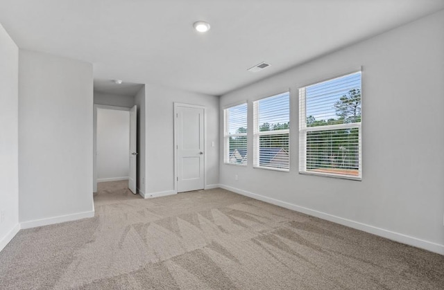 734 Great Oak Pl, Villa Rica, GA 30180 - unfurnished bedroom with baseboards, carpet, and visible vents