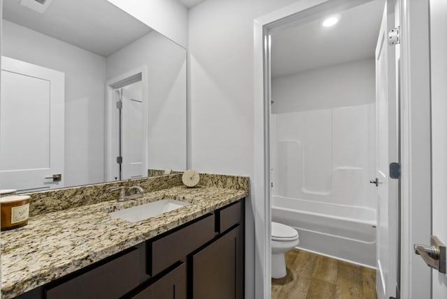 734 Great Oak Pl, Villa Rica, GA 30180 - bathroom with vanity, shower / washtub combination, recessed lighting, toilet, and wood finished floors