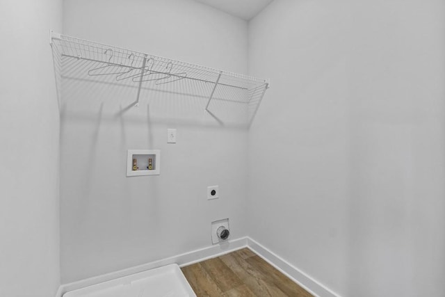 734 Great Oak Pl, Villa Rica, GA 30180 - washroom featuring hookup for an electric dryer, dark wood-style flooring, baseboards, laundry area, and hookup for a washing machine