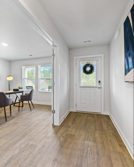 734 Great Oak Pl, Villa Rica, GA 30180 - foyer entrance with visible vents, baseboards, and wood finished floors