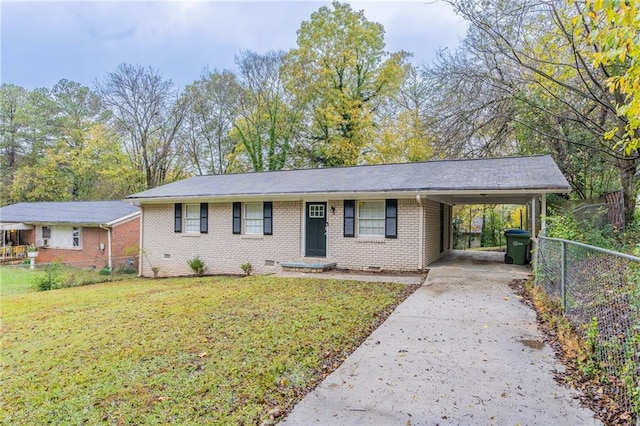 view of front of home with a carport and a front lawn