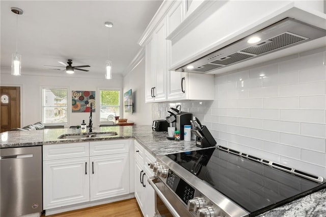 kitchen featuring sink, stainless steel appliances, custom exhaust hood, and white cabinetry