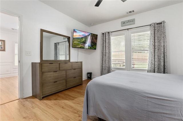 bedroom with ceiling fan and light hardwood / wood-style flooring