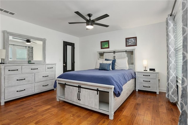 bedroom featuring ceiling fan and dark wood-type flooring