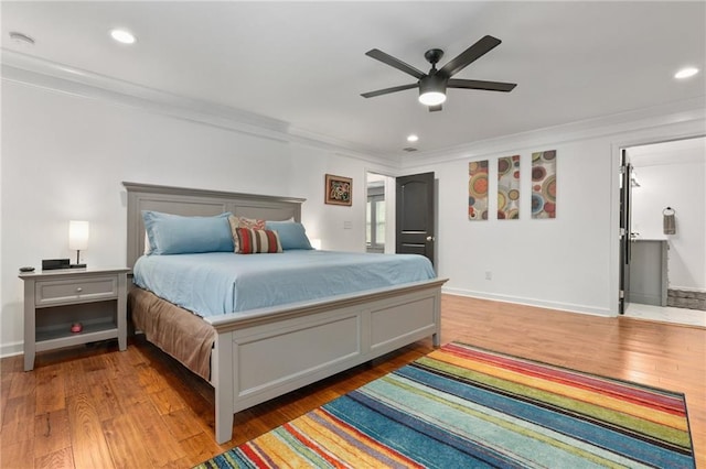 bedroom featuring crown molding, wood-type flooring, and ceiling fan