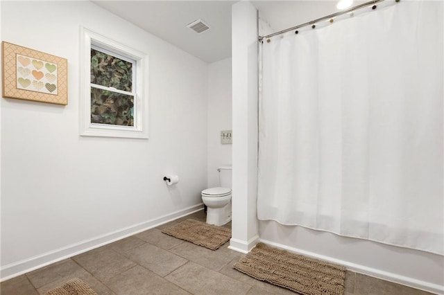 bathroom with toilet and shower / bath combo