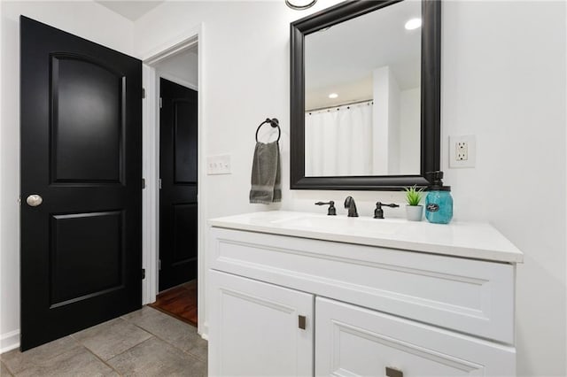 bathroom with vanity, tile patterned floors, and a shower with curtain