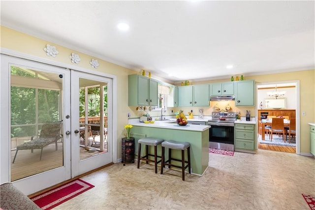 599 Palmer Ct SE, Conyers, GA 30094 - kitchen with a kitchen breakfast bar, french doors, kitchen peninsula, electric stove, and light tile floors
