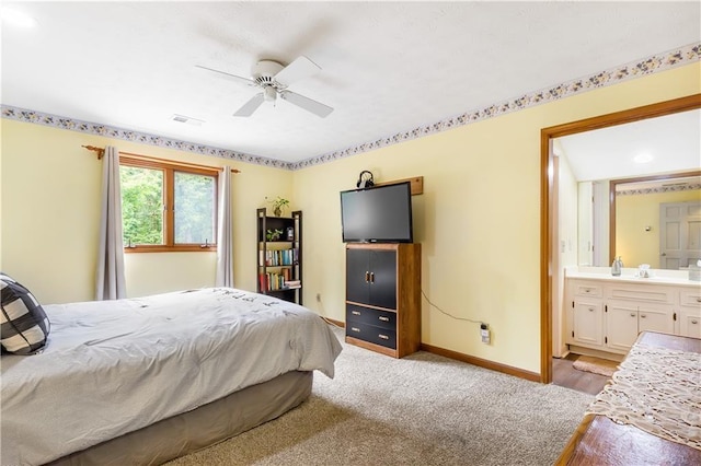 599 Palmer Ct SE, Conyers, GA 30094 - bedroom featuring ceiling fan, ensuite bath, and sink