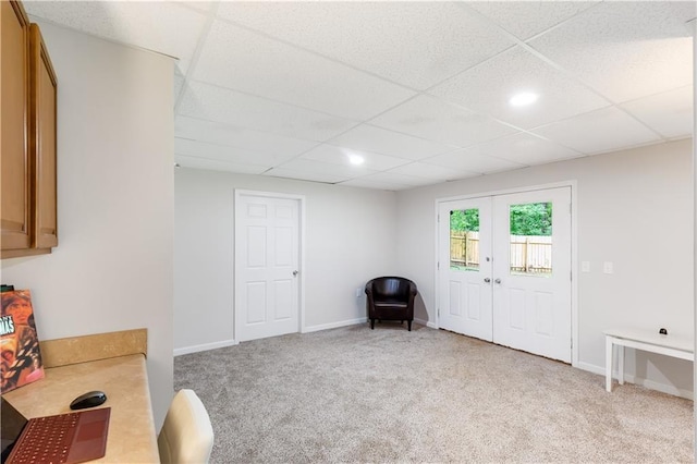 599 Palmer Ct SE, Conyers, GA 30094 - interior space with light carpet, french doors, and a paneled ceiling