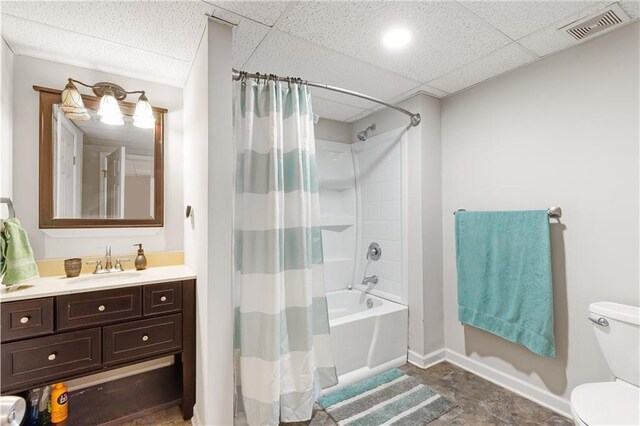 599 Palmer Ct SE, Conyers, GA 30094 - full bathroom featuring shower / bath combo with shower curtain, tile floors, a drop ceiling, vanity, and toilet