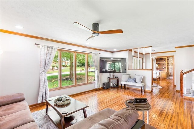599 Palmer Ct SE, Conyers, GA 30094 - living room featuring ceiling fan, built in shelves, hardwood / wood-style floors, and ornamental molding