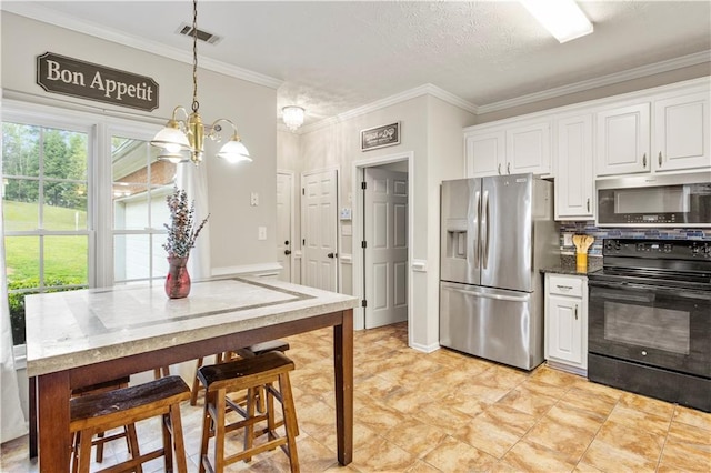 kitchen featuring white cabinetry, crown molding, visible vents, and stainless steel appliances