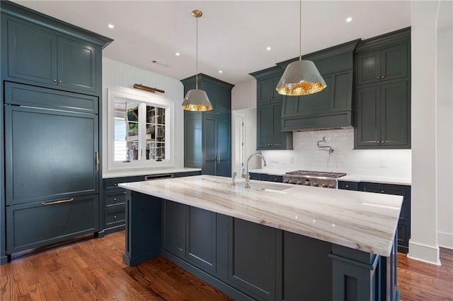 1830 Maple St, Carrollton, GA 30117 - kitchen with a sink, decorative backsplash, dark wood finished floors, light stone countertops, and recessed lighting