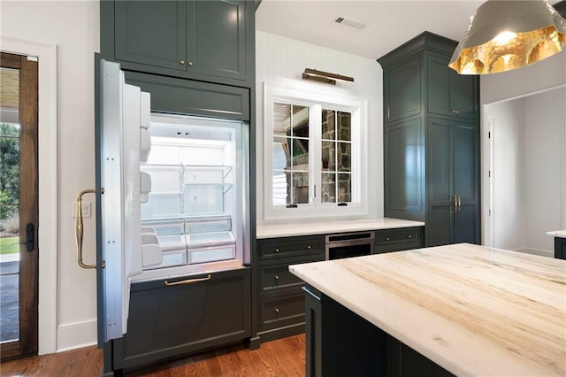 1830 Maple St, Carrollton, GA 30117 - kitchen with dark wood-style flooring and stainless steel appliances