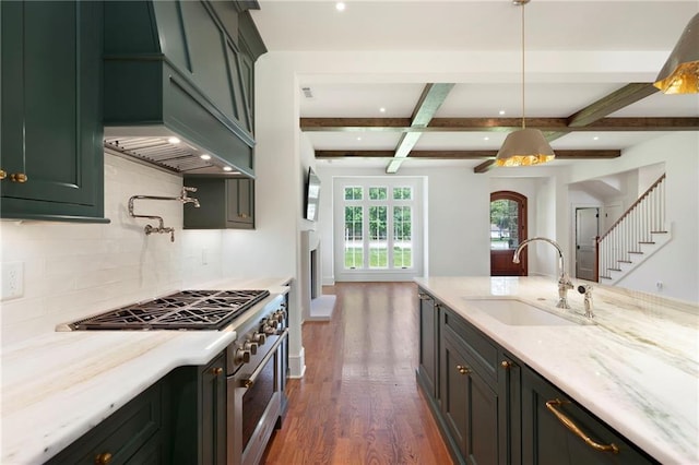 1830 Maple St, Carrollton, GA 30117 - kitchen featuring a sink, high end stainless steel range oven, dark wood-type flooring, decorative backsplash, and beamed ceiling