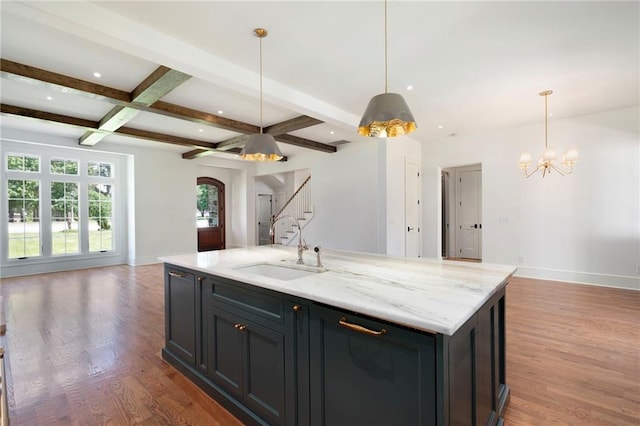 1830 Maple St, Carrollton, GA 30117 - kitchen featuring open floor plan, a sink, wood finished floors, beam ceiling, and baseboards