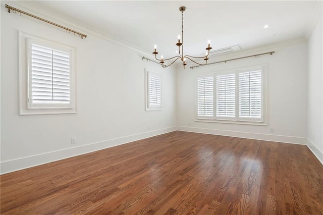 1830 Maple St, Carrollton, GA 30117 - empty room featuring a chandelier, crown molding, dark wood-type flooring, and baseboards