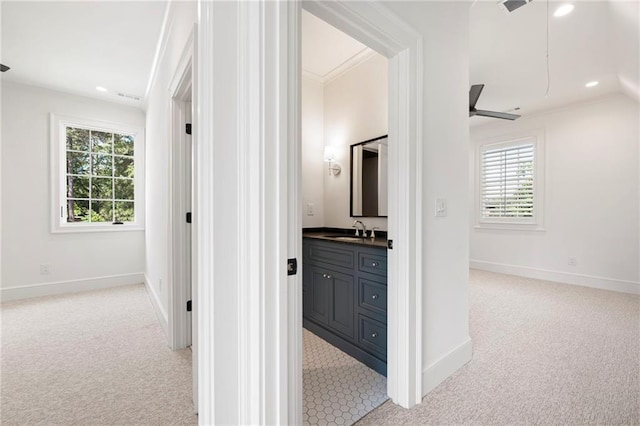 1830 Maple St, Carrollton, GA 30117 - corridor featuring light colored carpet, a sink, healthy amount of natural light, recessed lighting, and ornamental molding