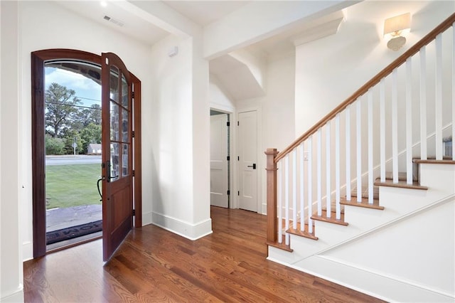 1830 Maple St, Carrollton, GA 30117 - foyer featuring wood finished floors, stairway, and baseboards
