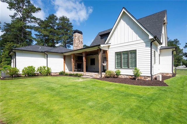 1830 Maple St, Carrollton, GA 30117 - back of property featuring a chimney, board and batten siding, and roof with shingles