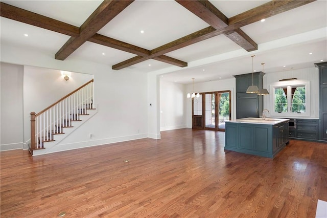 1830 Maple St, Carrollton, GA 30117 - kitchen featuring light countertops, open floor plan, wood finished floors, beamed ceiling, and coffered ceiling