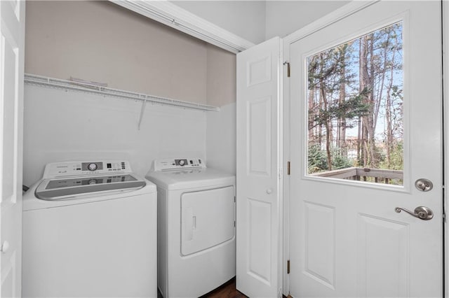 clothes washing area featuring washing machine and dryer