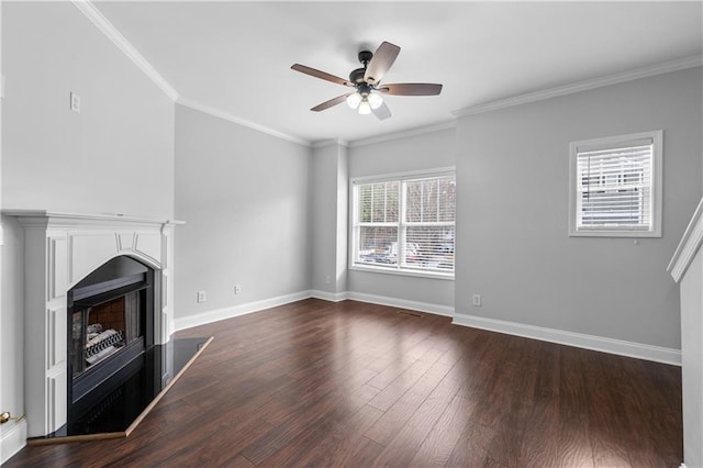 unfurnished living room with ceiling fan, crown molding, and dark wood-type flooring