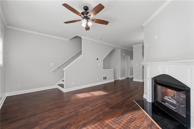 unfurnished living room featuring dark wood-type flooring, ceiling fan, and ornamental molding