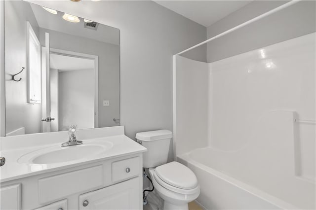 full bathroom with bathing tub / shower combination, vanity, and toilet