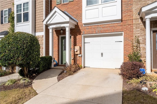 view of exterior entry with a garage