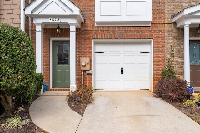 doorway to property featuring a garage