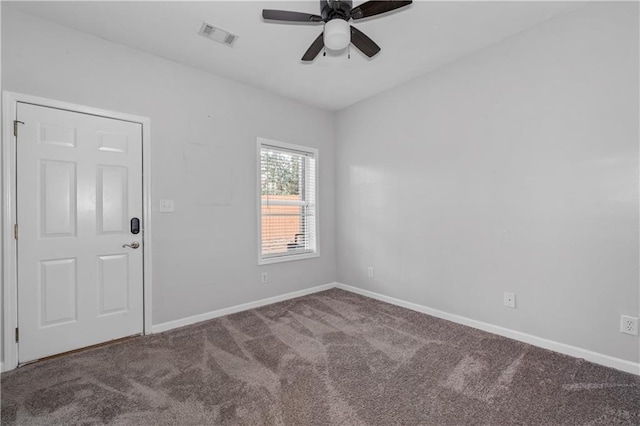 carpeted empty room featuring ceiling fan