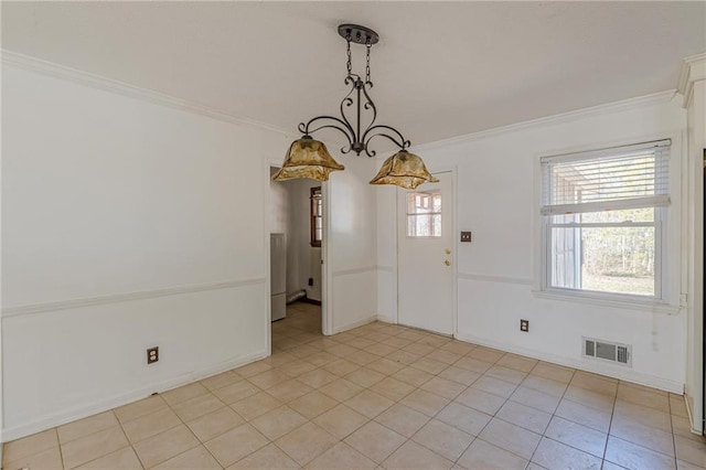 interior space featuring ornamental molding and light tile patterned floors