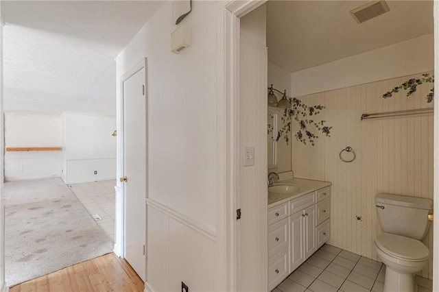 bathroom with vanity and toilet