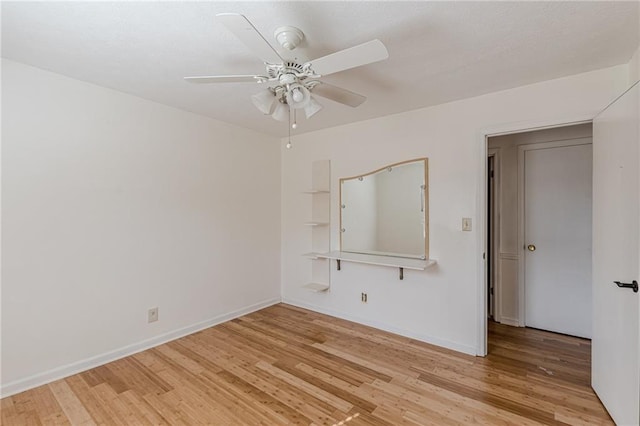 unfurnished bedroom with ceiling fan and light wood-type flooring