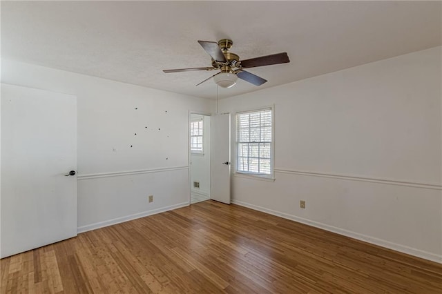 empty room featuring hardwood / wood-style flooring and ceiling fan