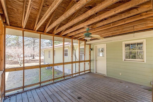 unfurnished sunroom featuring plenty of natural light and ceiling fan