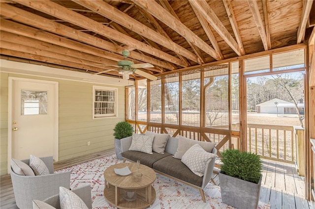 sunroom featuring ceiling fan