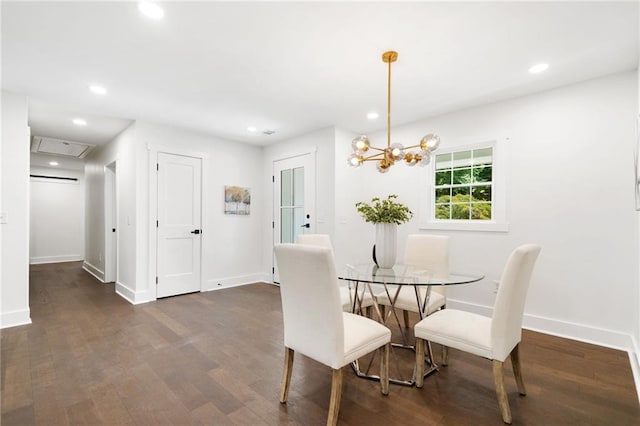 dining area featuring a notable chandelier and dark hardwood / wood-style flooring