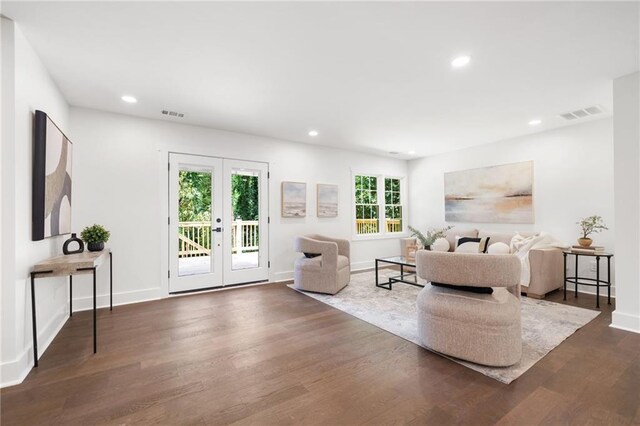 living room featuring french doors and dark hardwood / wood-style flooring