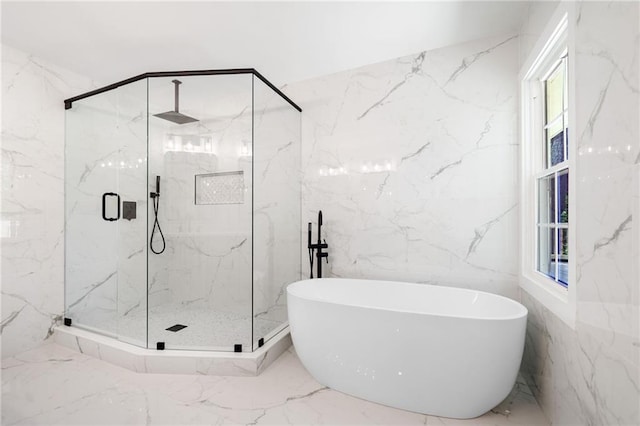 bathroom featuring tile walls, plenty of natural light, tile patterned flooring, and separate shower and tub