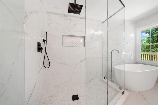 bathroom featuring tile walls, walk in shower, and tile patterned flooring