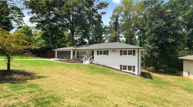 back of house featuring a garage and a lawn