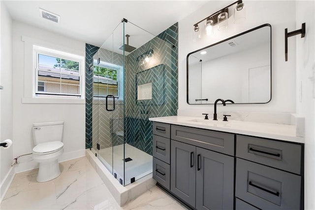 bathroom with a shower with shower door, vanity, toilet, and tile patterned flooring