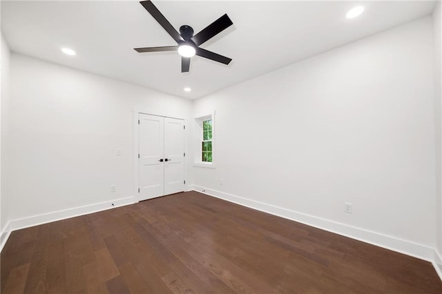 empty room with ceiling fan and hardwood / wood-style flooring