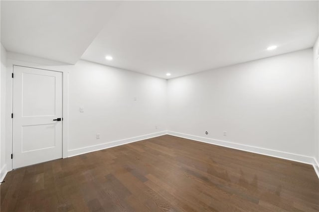 empty room featuring dark wood-type flooring