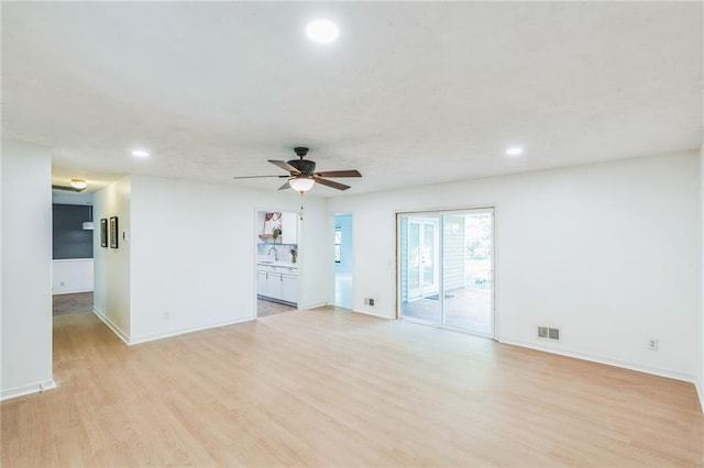 364 Stafford St SW, Marietta, GA 30064 - unfurnished living room with light wood finished floors, recessed lighting, and a ceiling fan
